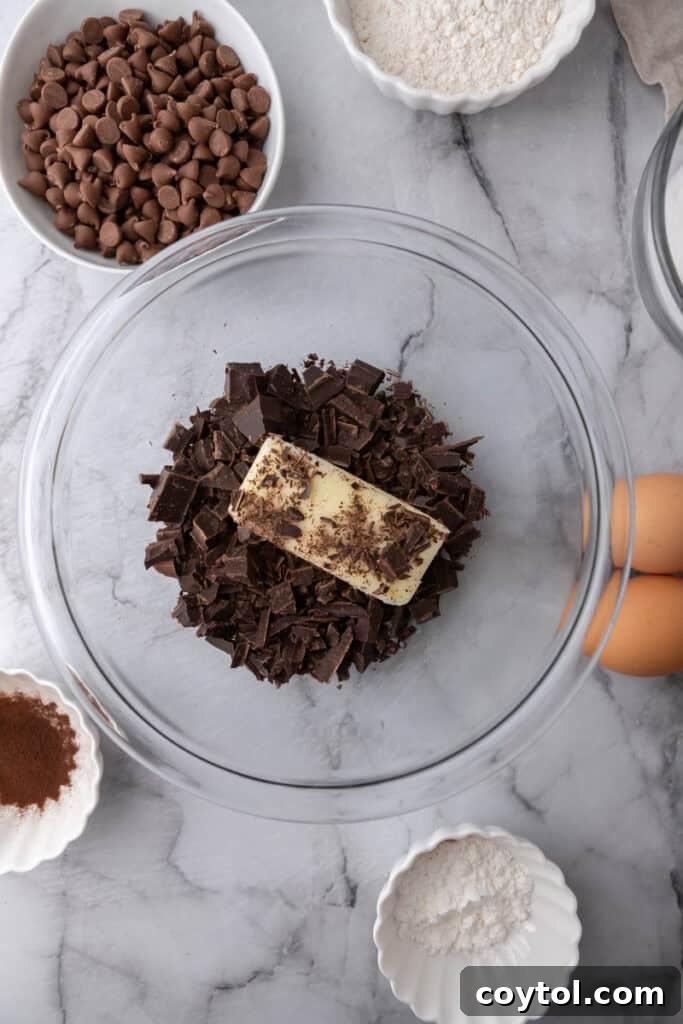 Chopped chocolate with butter and oil in a bowl