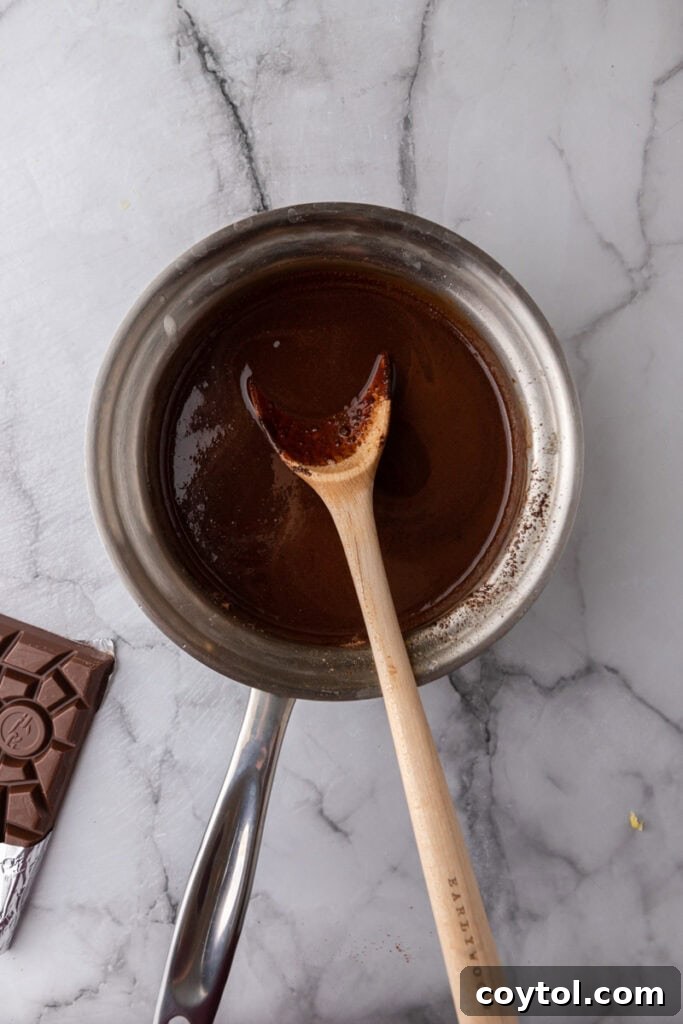 Smooth, glossy chocolate and brown butter mixture in a saucepan