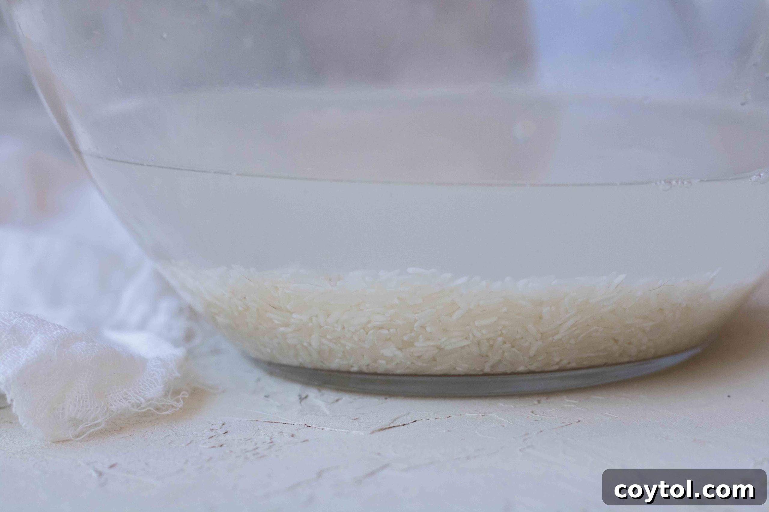 White rice and water added to a pot on the stovetop