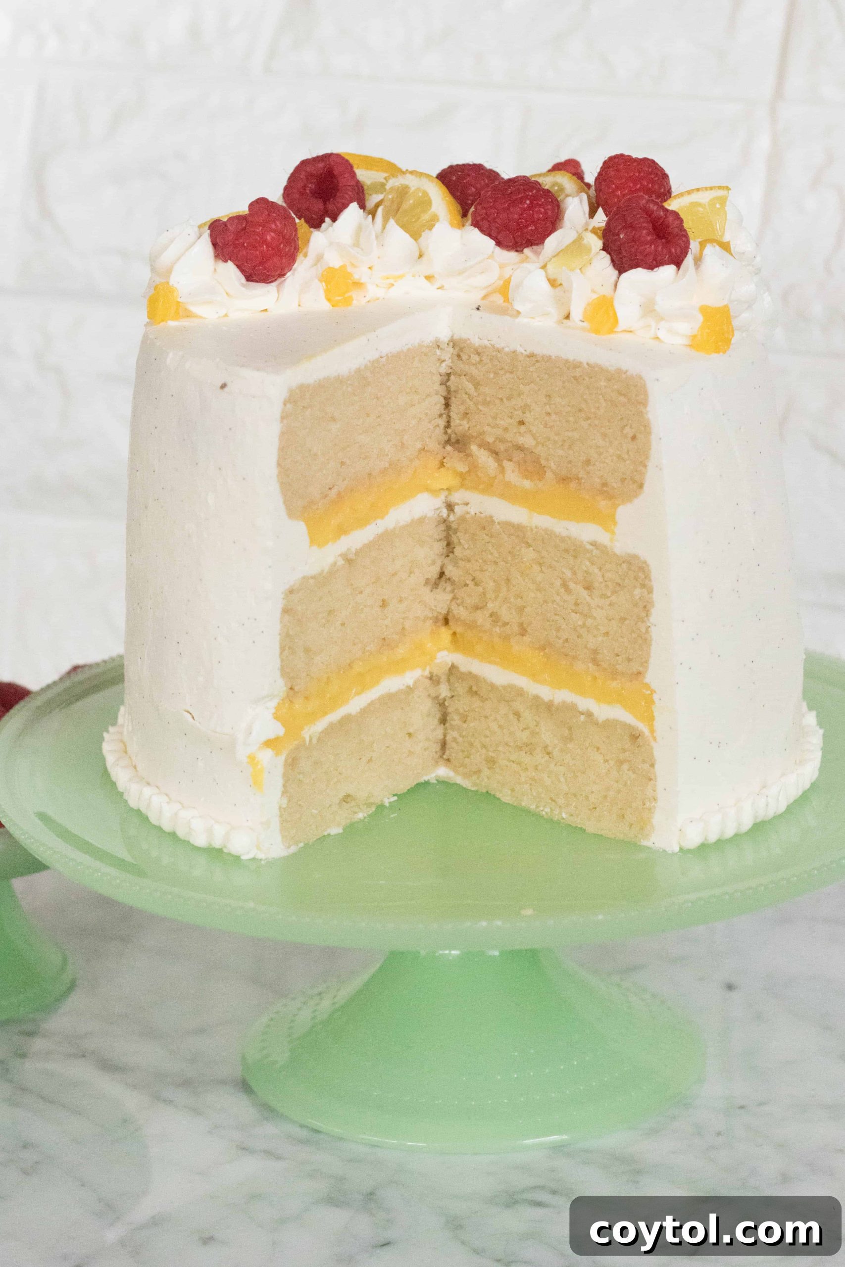 Triple-Layer Vanilla Cake with Lemon Curd and Italian Buttercream 12 Layered Vanilla Cake with Lemon Curd & Italian Buttercream on a stand
