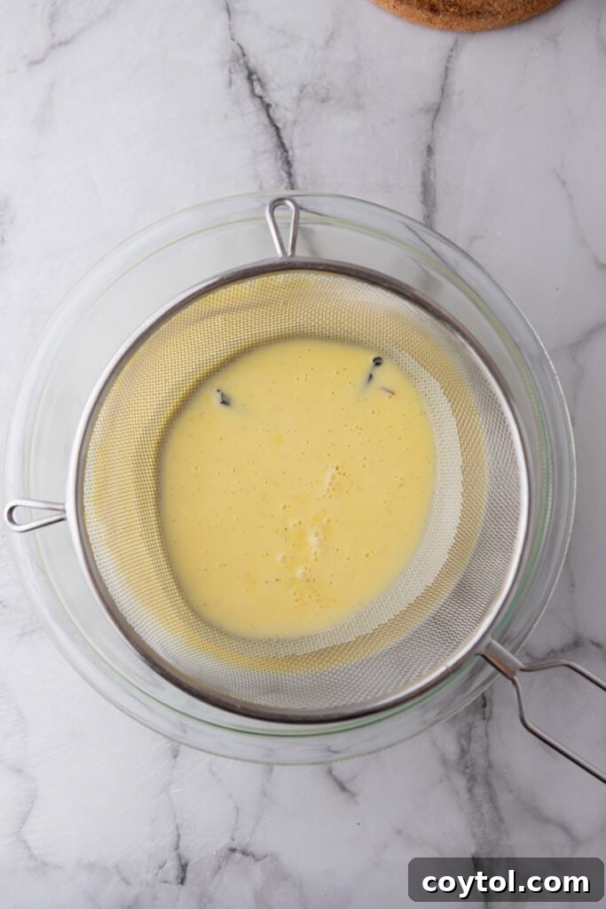 Velvet Vanilla Custard Ice Cream Made Simple 11 straining custard through a fine mesh sieve into a clean bowl