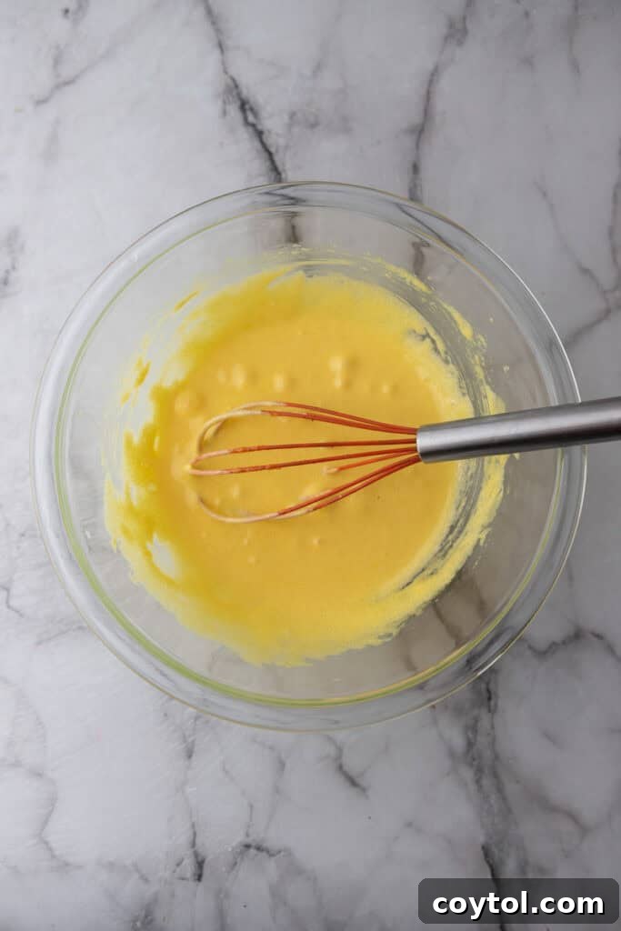 Velvet Vanilla Custard Ice Cream Made Simple 7 whisked egg yolks and sugar in a bowl, pale and thickened