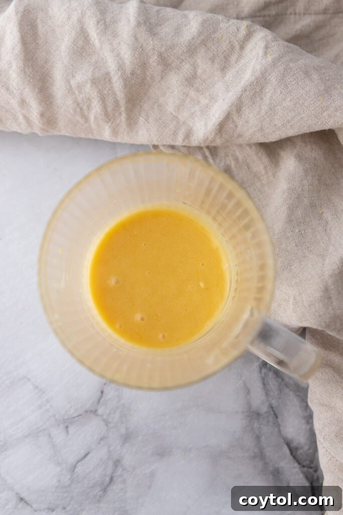 Speedy Lemon Mug Cake in Minutes 7 batter in a mug