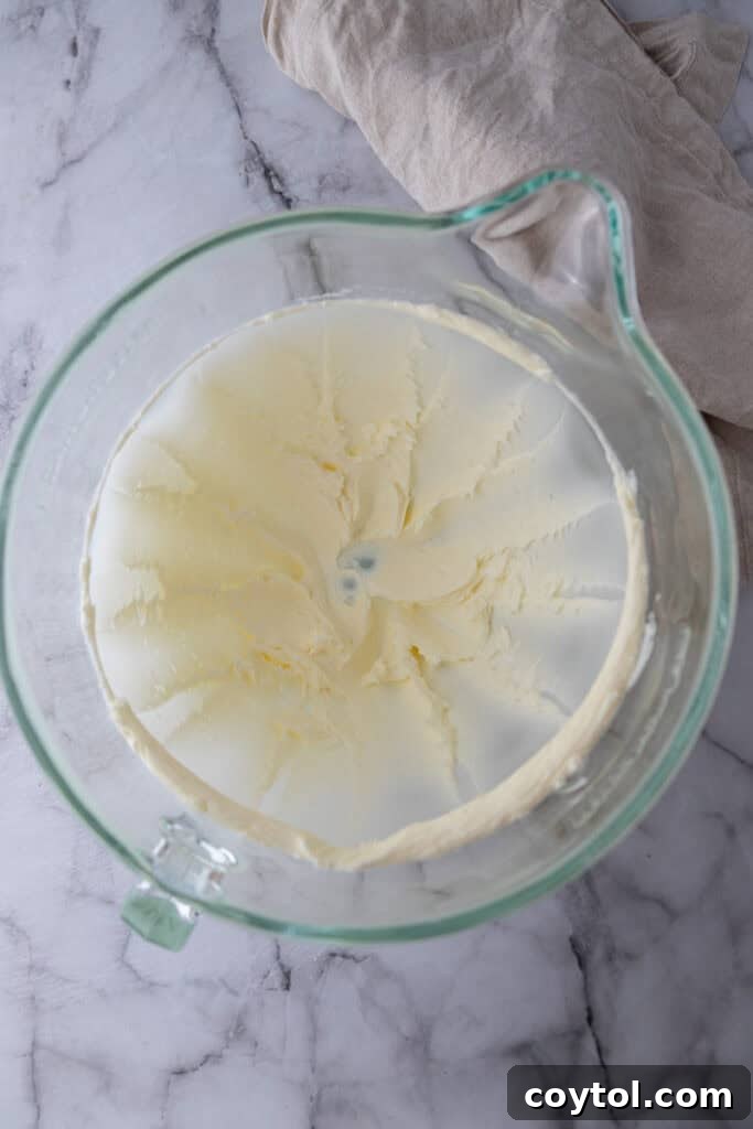 butter being beaten by a mixer
