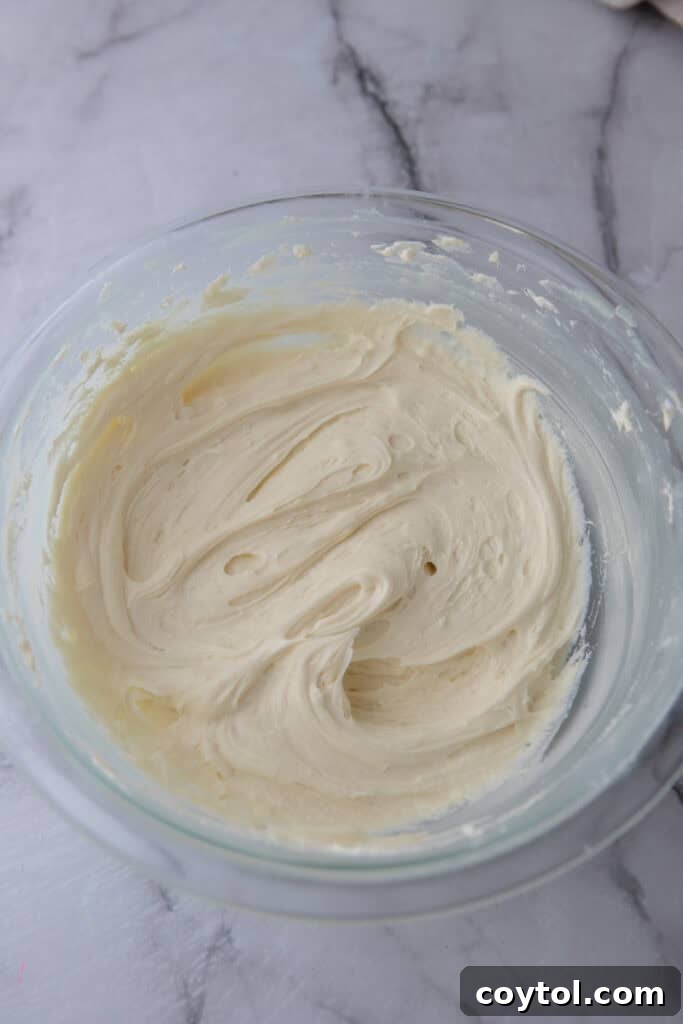 The Ultimate White Chocolate Ganache Recipe 2 white chocolate ganache recipe in a bowl