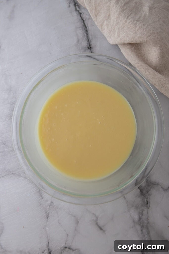 The Ultimate White Chocolate Ganache Recipe 7 ingredients in a bowl