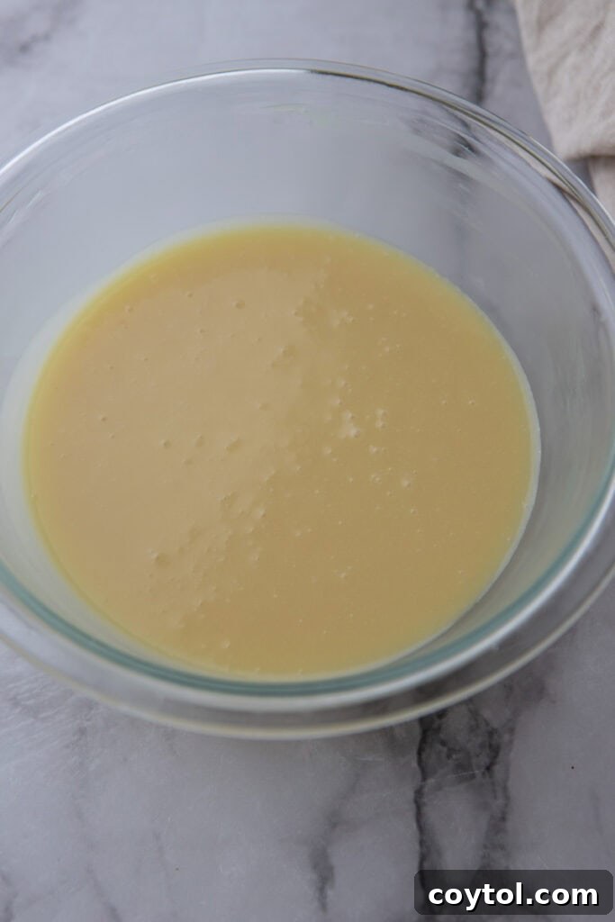 The Ultimate White Chocolate Ganache Recipe 9 ingredients in a bowl