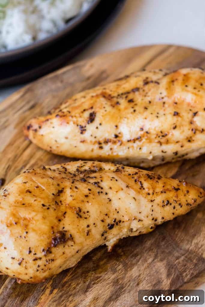 Perfectly air fried chicken breast ready to be removed.