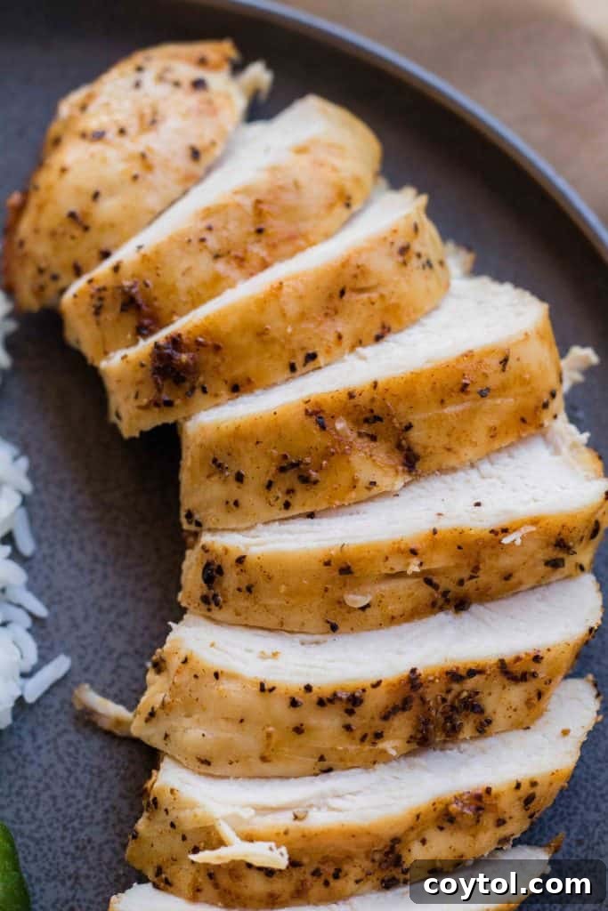 Marinating chicken breast with olive oil and spices for air frying