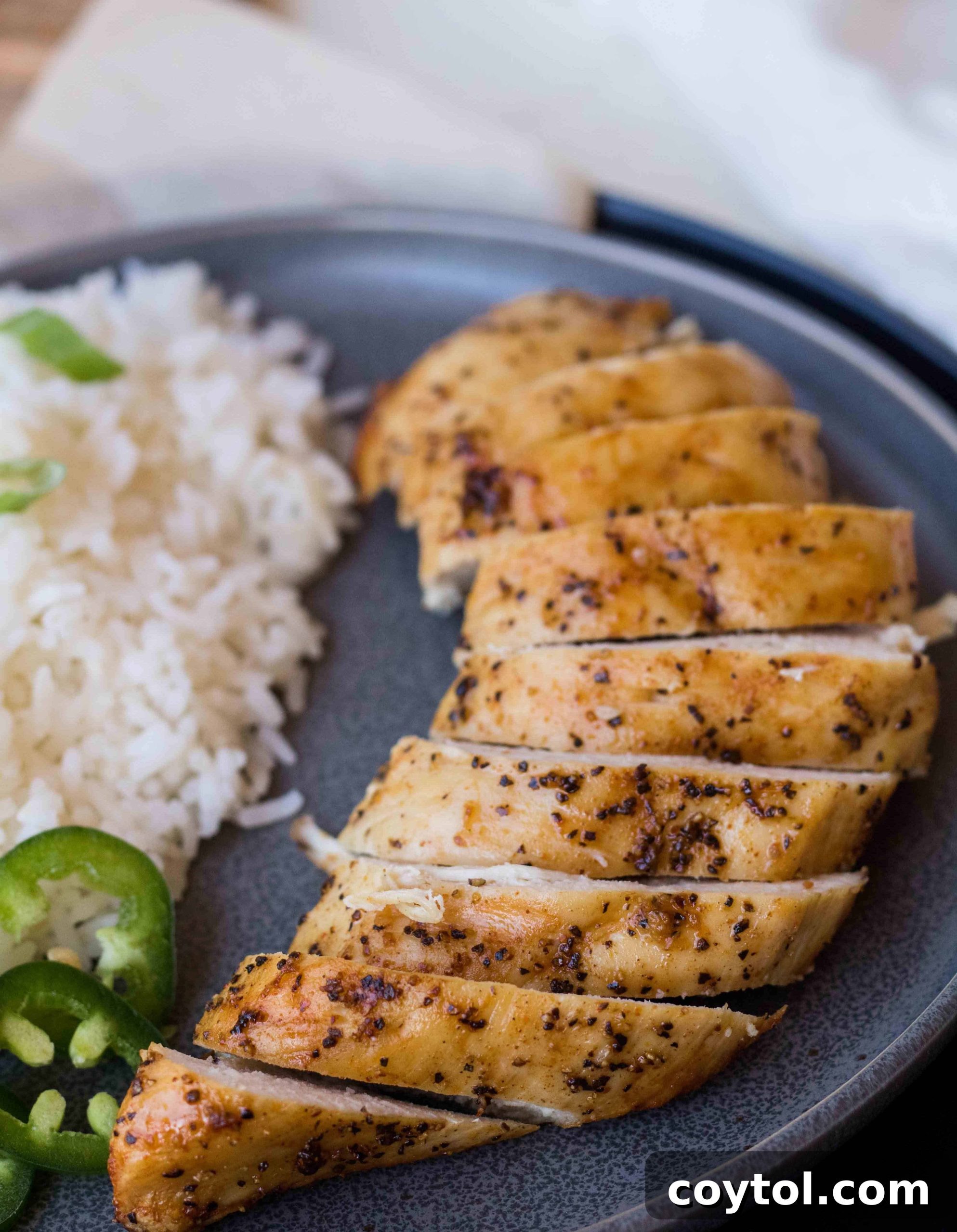 Checking the internal temperature of air fried chicken breast