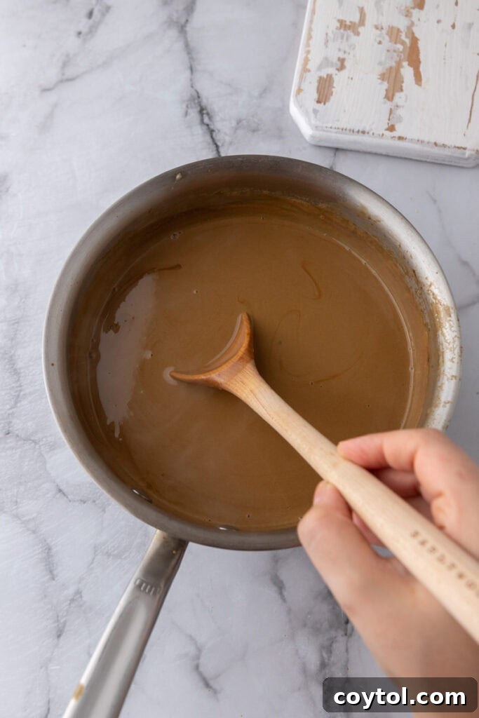 ingredients and a wooden spoon in a pot