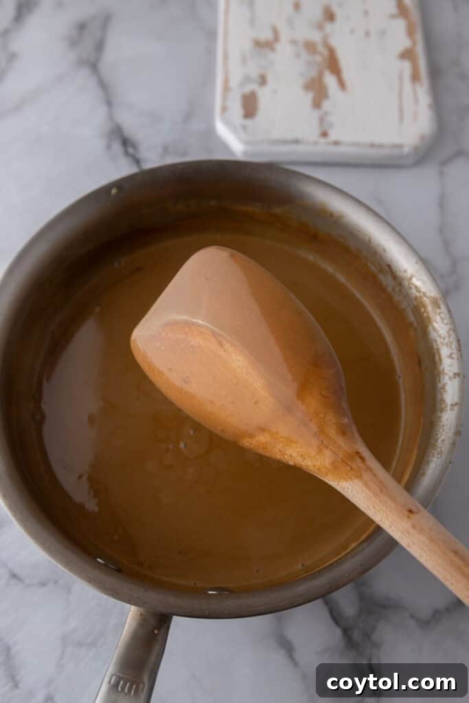 ingredients and a wooden spoon in a pot