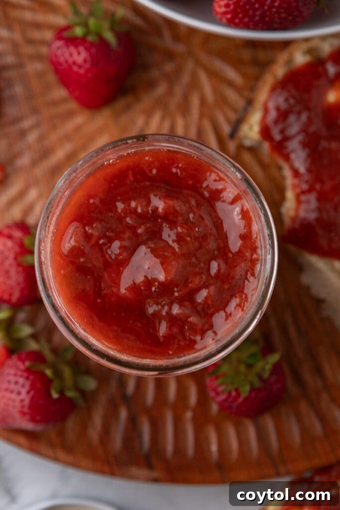 Homemade Strawberry Rhubarb Jam Without Pectin 11 Overhead shot of homemade strawberry rhubarb jam in multiple jars.