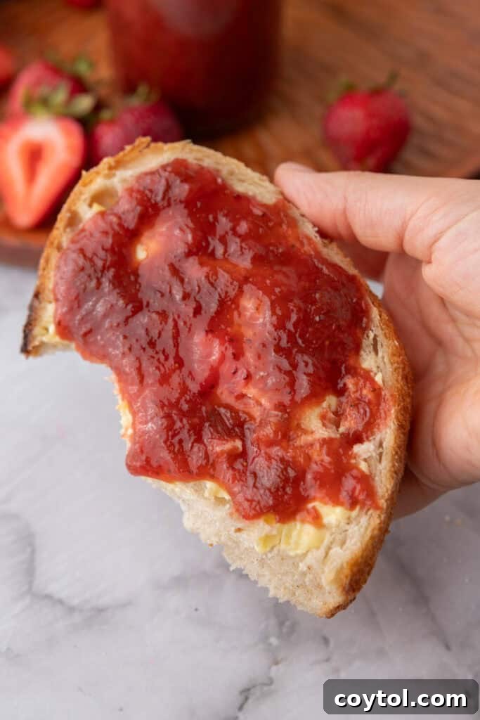 Homemade Strawberry Rhubarb Jam Without Pectin 12 Strawberry rhubarb jam spread on toast, ready to be enjoyed.