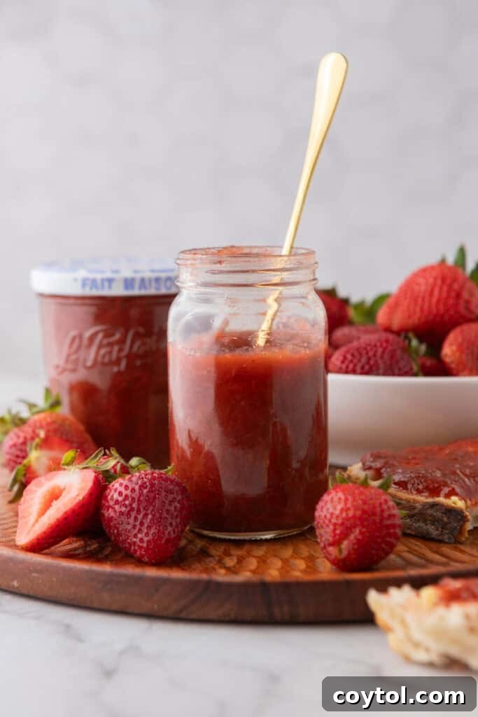 Homemade Strawberry Rhubarb Jam Without Pectin 4 A jar of homemade strawberry rhubarb jam, showcasing its beautiful color and texture.