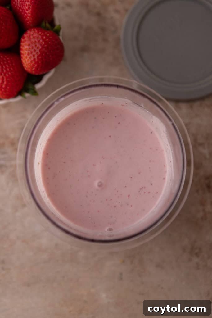Effortless Strawberry Cottage Cheese Ice Cream with Ninja Creami 5 blended ice cream base in container