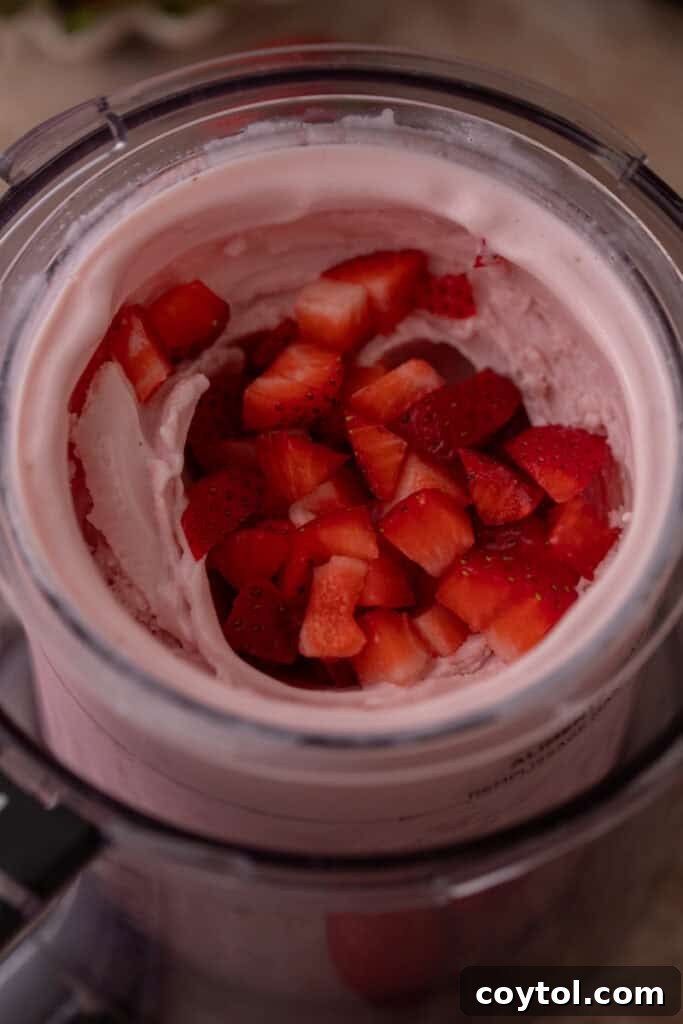 Effortless Strawberry Cottage Cheese Ice Cream with Ninja Creami 9 Mix-ins added to ninja creami ice cream
