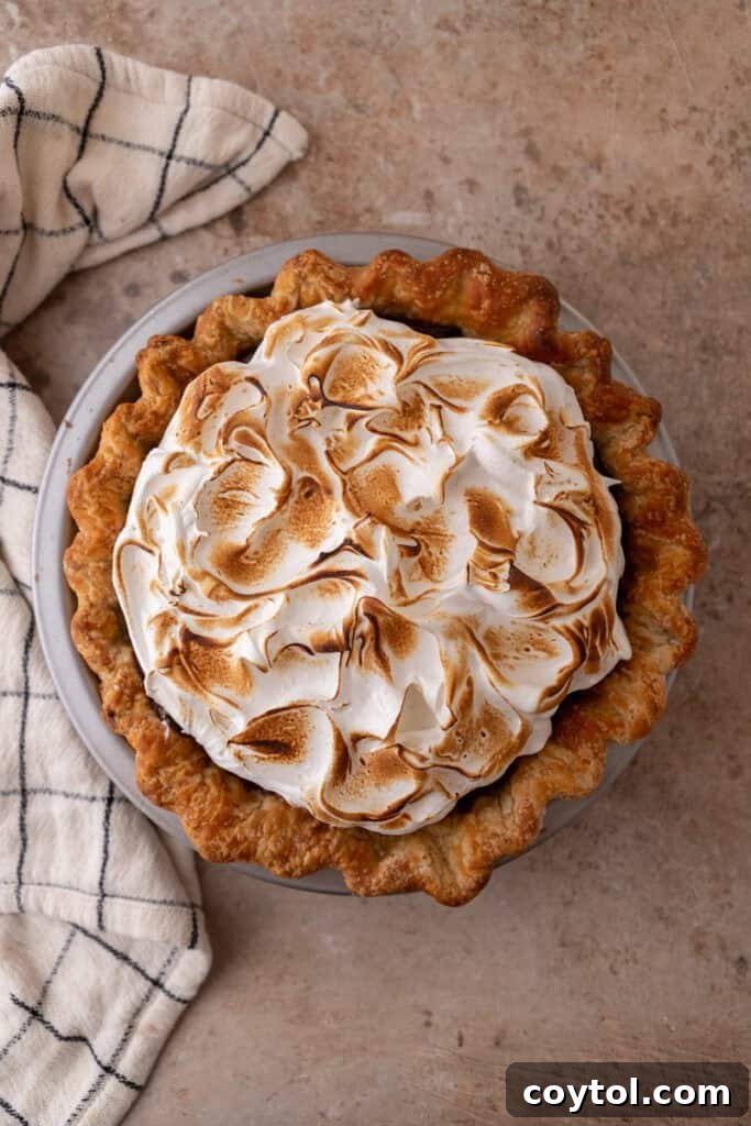 Fluffy Chocolate Meringue Pie Perfection 19 topping being toasted