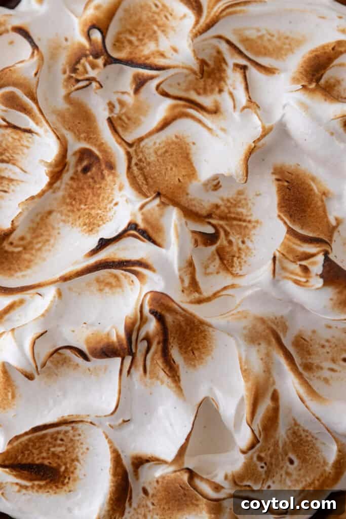 Fluffy Chocolate Meringue Pie Perfection 20 topping being toasted