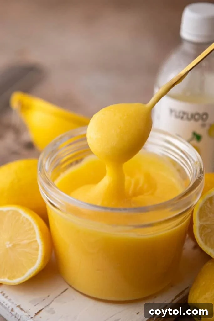 Yuzu Curd Recipe in a jar with a spoon