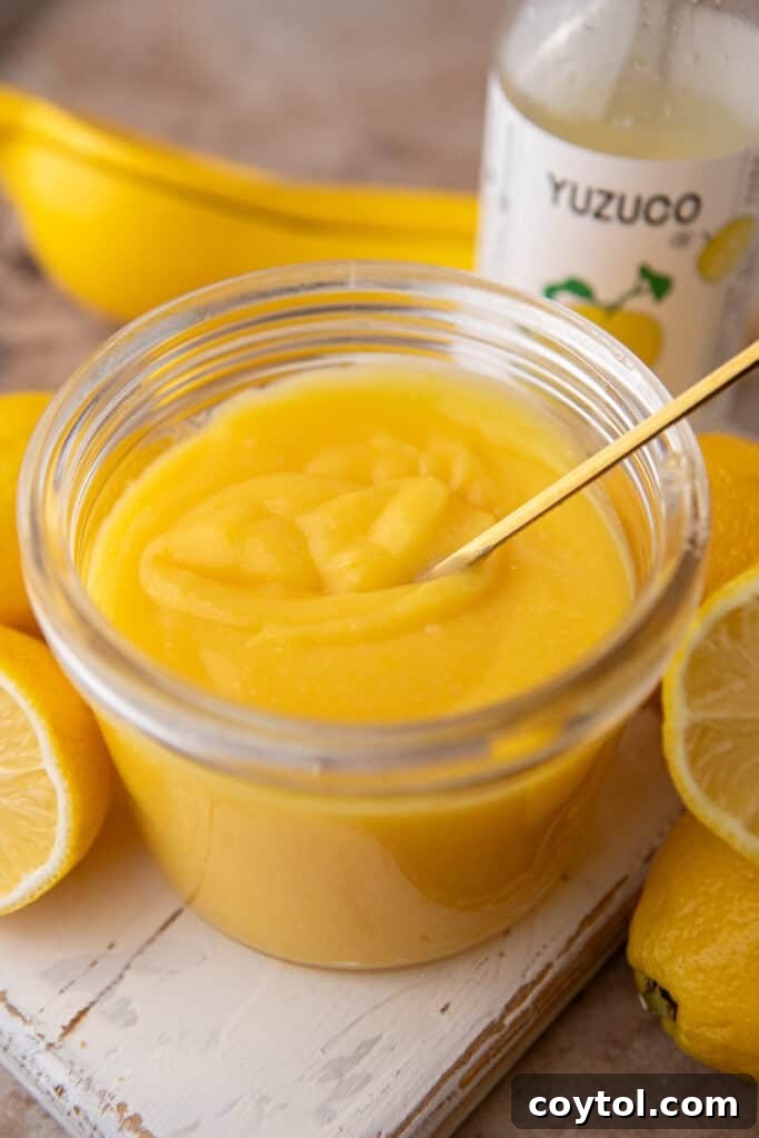 Yuzu Curd Recipe in a jar with a spoon
