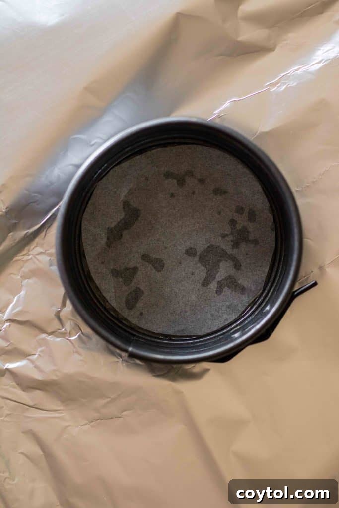 4-inch springform pan lined with parchment paper and aluminum foil for water bath