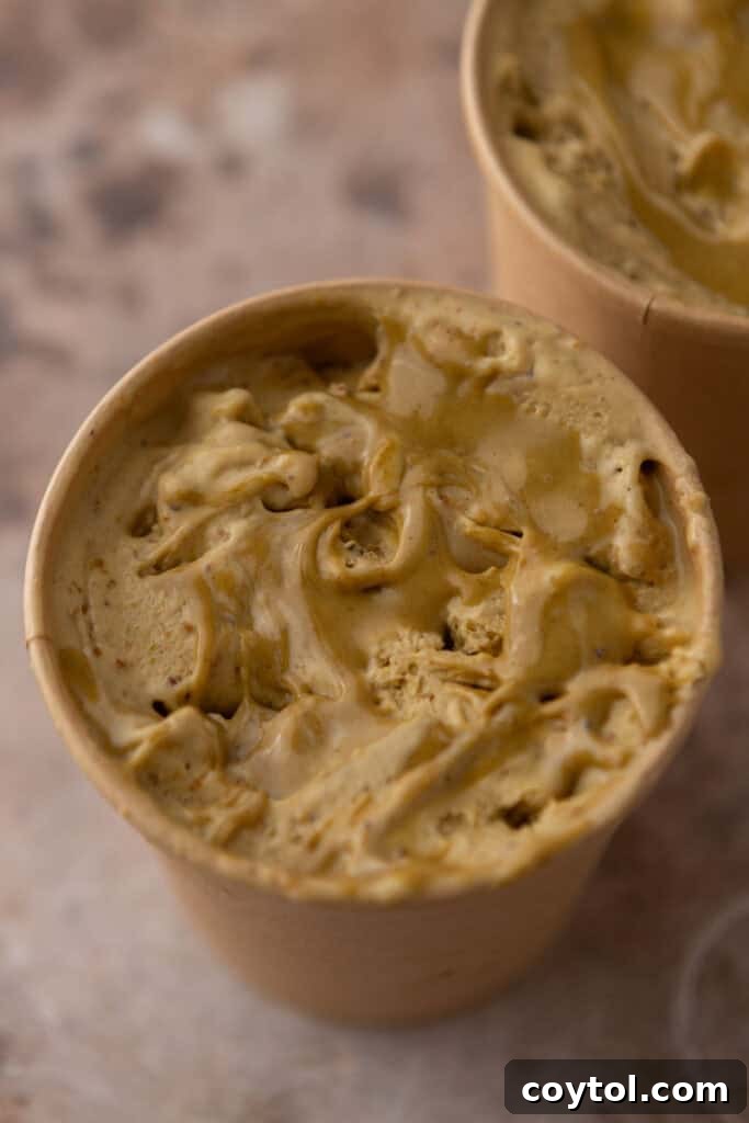 Crafting the Ultimate Homemade Pistachio Ice Cream 17 Finished pistachio ice cream in a container, ready for freezing