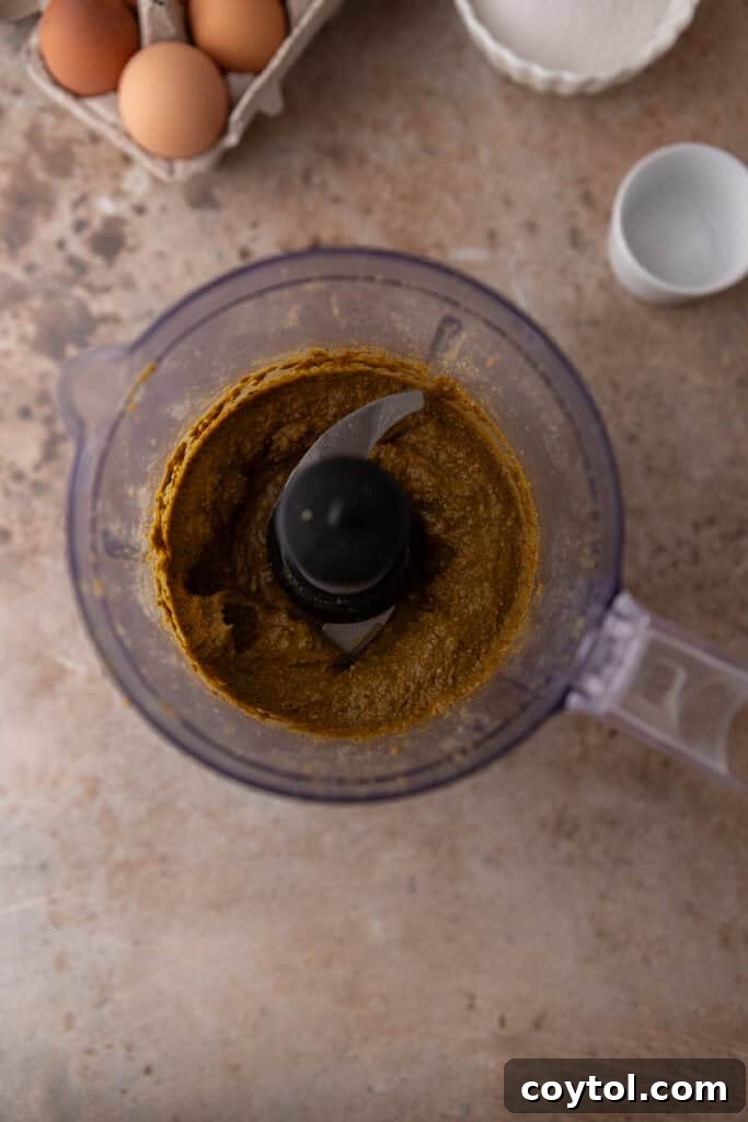 Crafting the Ultimate Homemade Pistachio Ice Cream 6 Pistachio paste forming in a food processor, showing a smooth texture