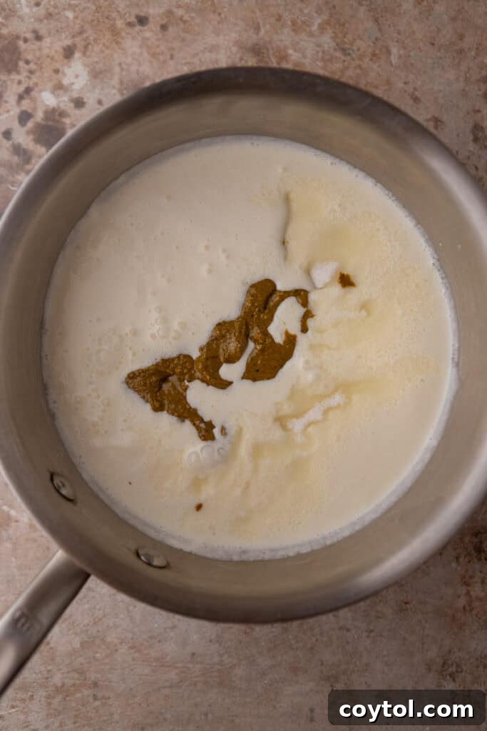 Crafting the Ultimate Homemade Pistachio Ice Cream 7 Pistachio paste, milk, cream, and sugar in a saucepan