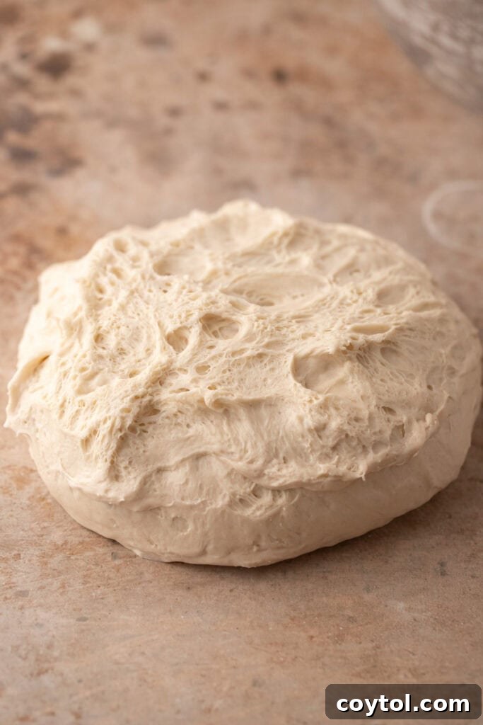 Sourdough dough after being flipped onto the work surface, ready for pre-shaping.