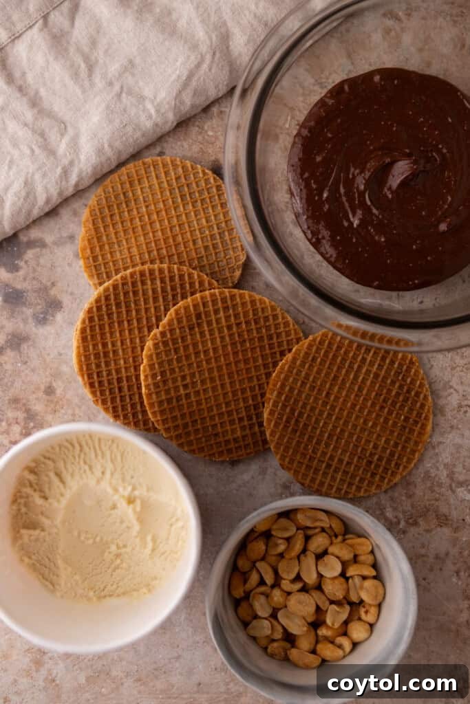 Ultimate Stroopwafel Choco Tacos Caramel Chocolate Perfection 3 All the simple ingredients laid out for making Stroopwafel Choco Tacos: stroopwafels, vanilla ice cream, chocolate, and peanuts.