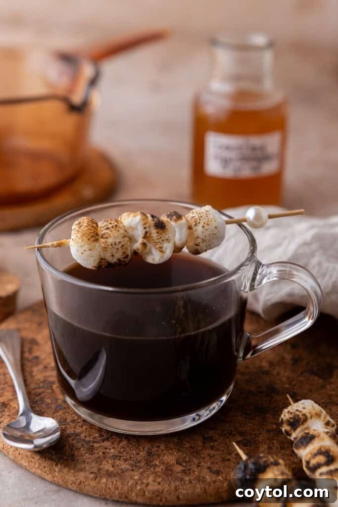 toasted marshmallows sitting on a coffee