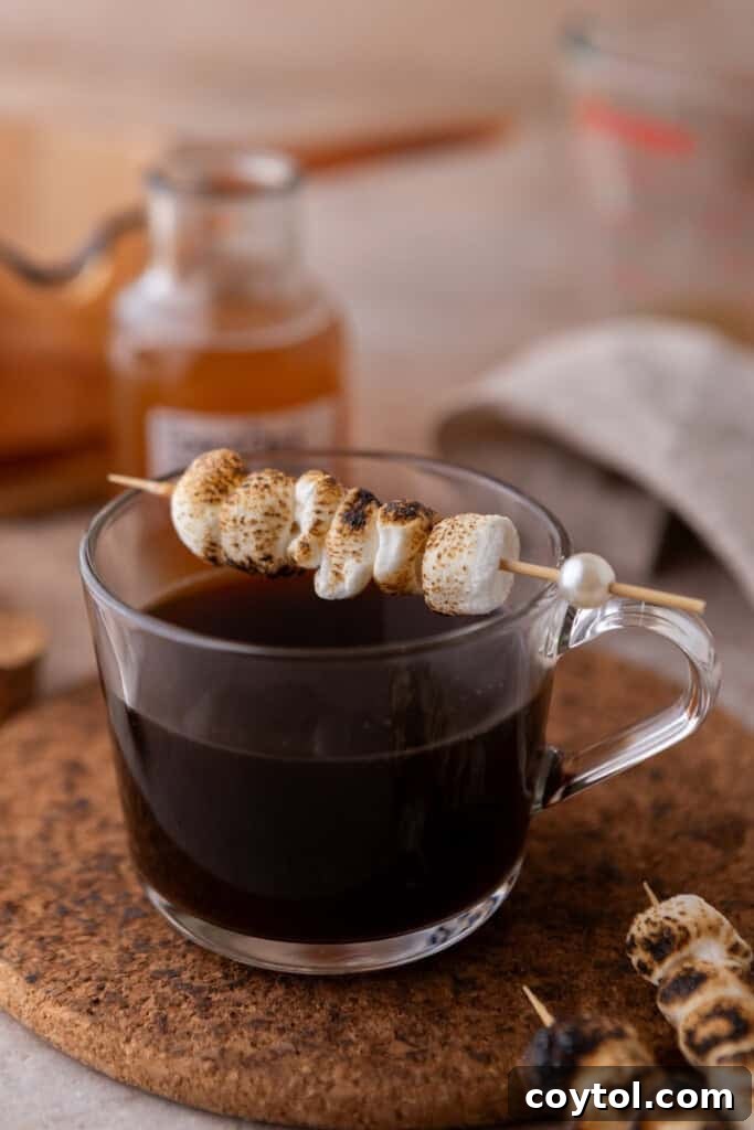 toasted marshmallows sitting on a coffee