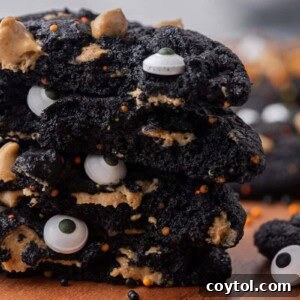 Close up of stack of black cocoa cookies for Halloween monster cookies