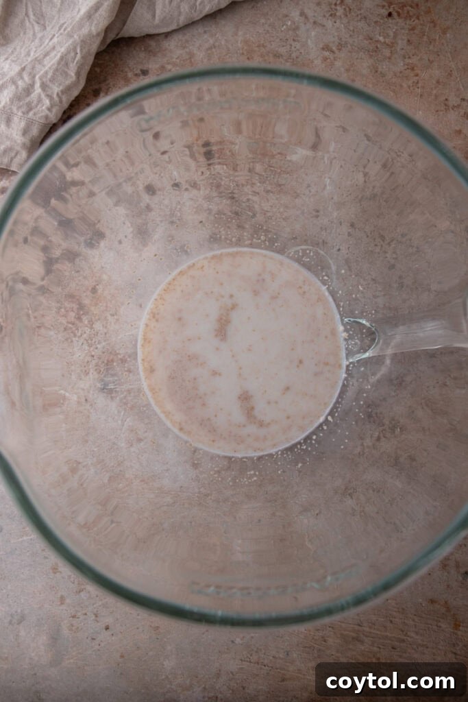 Pillowy Soft Buttery Holiday Rolls 4 Yeast and warm milk combined in a large mixing bowl, beginning the proofing process
