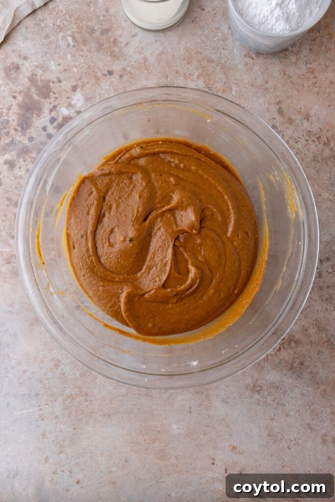 Mixed pumpkin bread batter in a bowl.