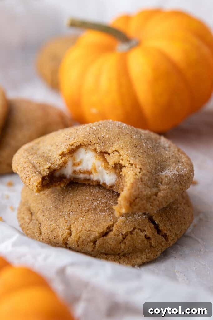 Pumpkin Cheesecake Cookies stacked on each other