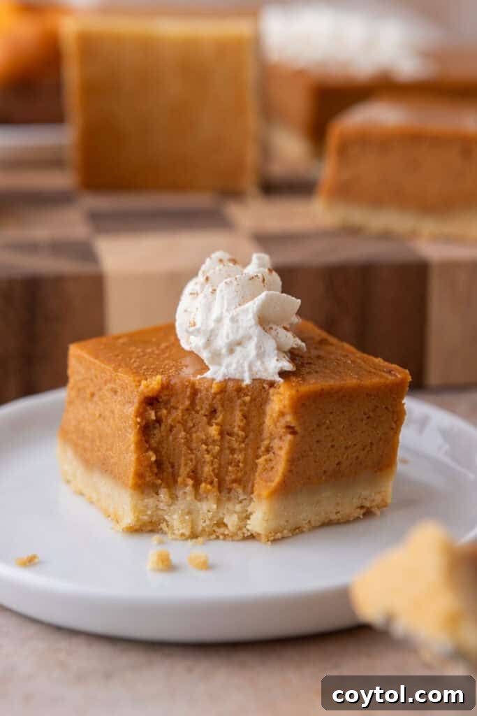 Irresistible Sweet Potato Pie Bars 16 sweet potato pie bars recipe square with a bite taken out