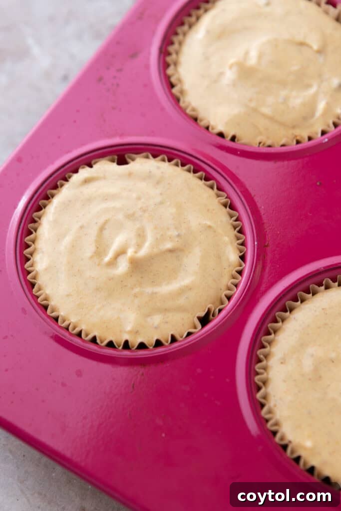 filling ingredients in the muffin liners