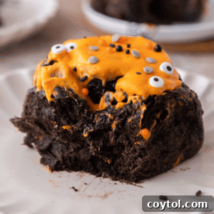 Halloween Black Cocoa Cinnamon Roll on a plate