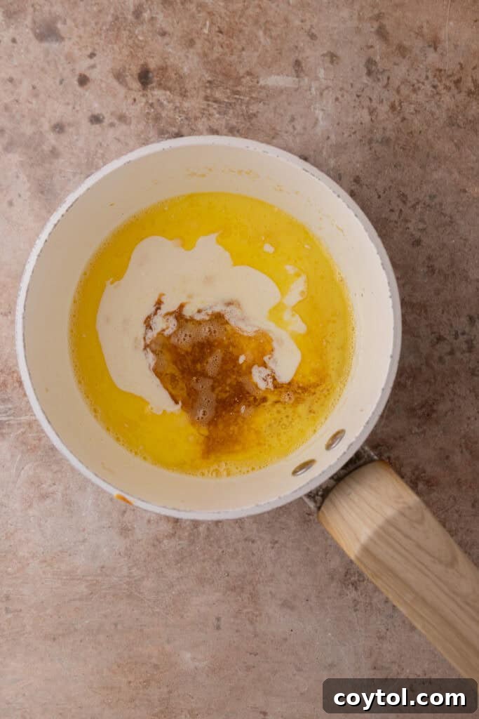Irresistible Pecan Pie Cheesecake Bites 20 Butter melting in a saucepan over low heat for the pecan topping.