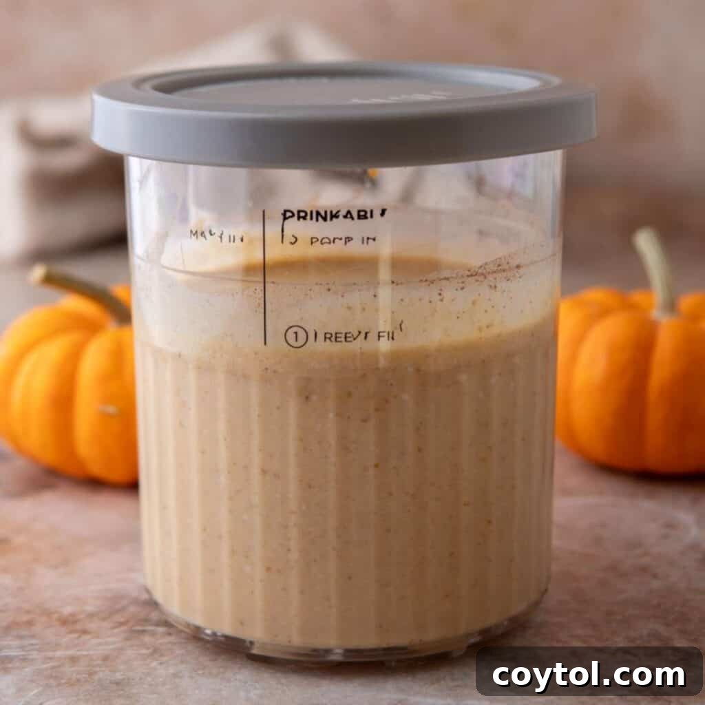 Ninja Creami Pumpkin Ice Cream with Cottage Cheese in the ninja creami pint container