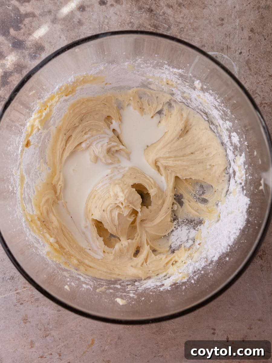 Cream cheese frosting being mixed to a smooth texture