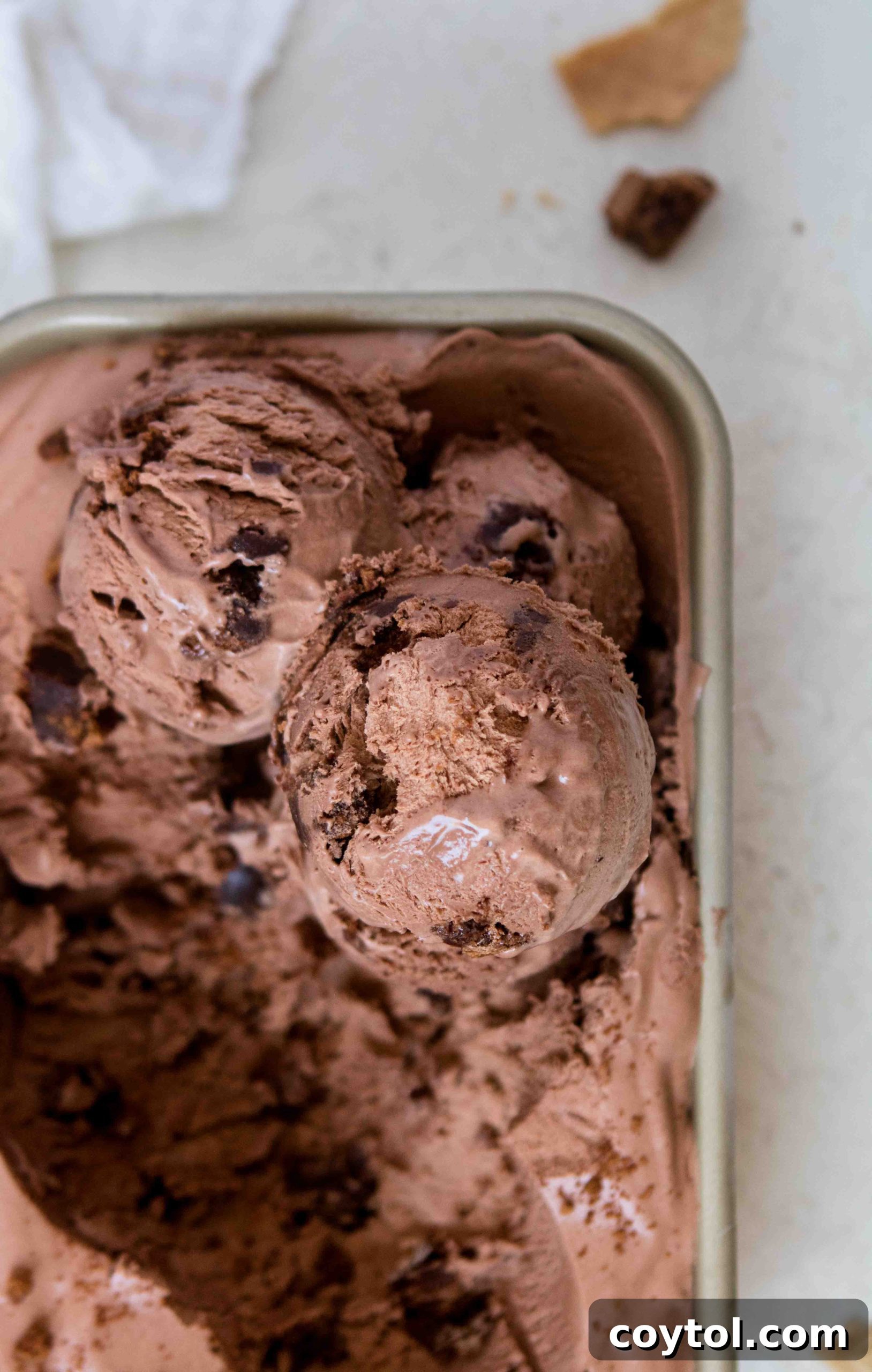 Close-up of no-churn chocolate ice cream scoops with visible brownie bits