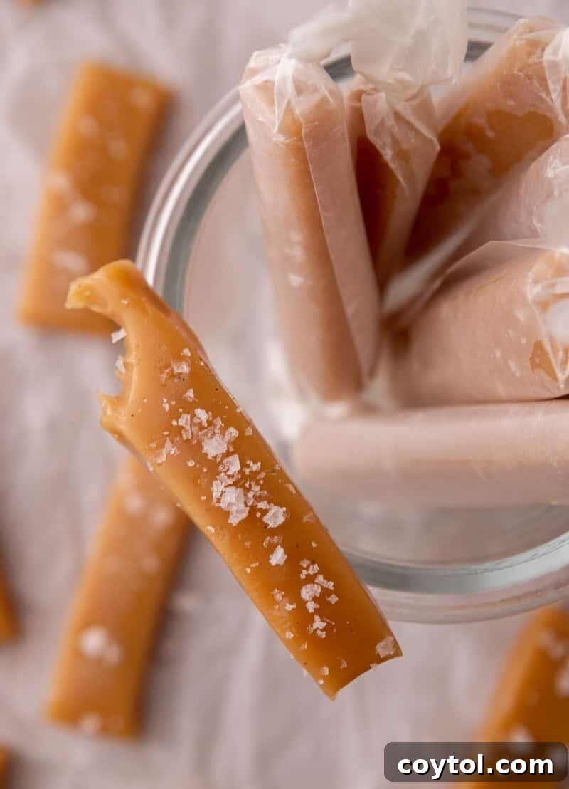 Wrapped soft caramels in wax paper with one partially eaten piece