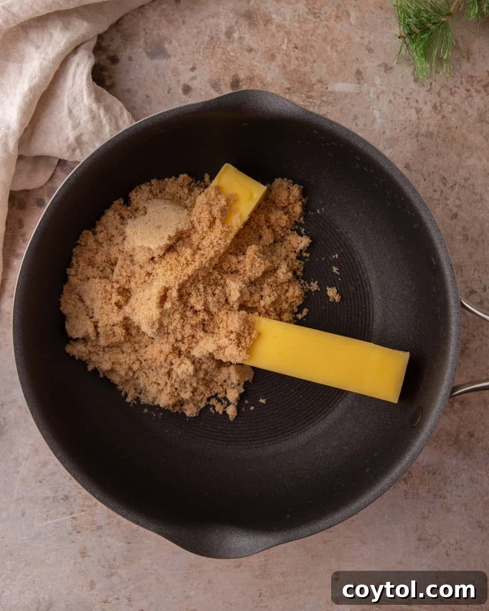 Butter and brown sugar in a saucepan explaining the toffee base
