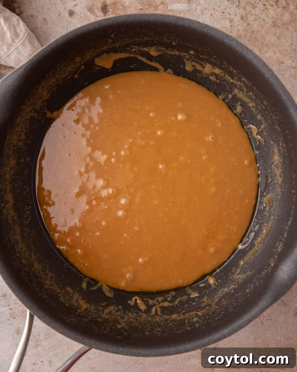 Melted brown sugar and butter toffee mixture in saucepan