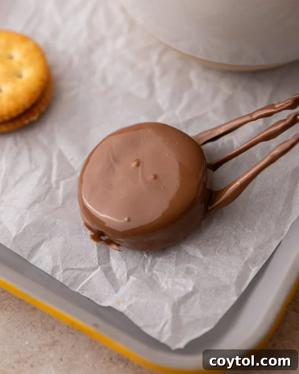 Easy No-Bake Ritz Peanut Butter Chocolate Sandwiches 7 Chocolate coated Ritz cookie dripping excess chocolate
