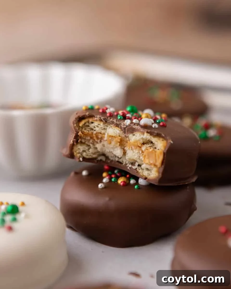 Easy No-Bake Ritz Peanut Butter Chocolate Sandwiches 9 Stacked Ritz peanut butter cookies showing chocolate shell and peanut butter center