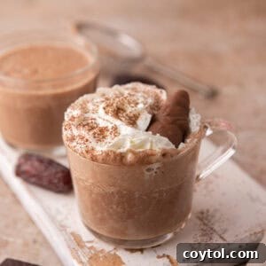 Creamy date sweetened hot chocolate served in a glass mug